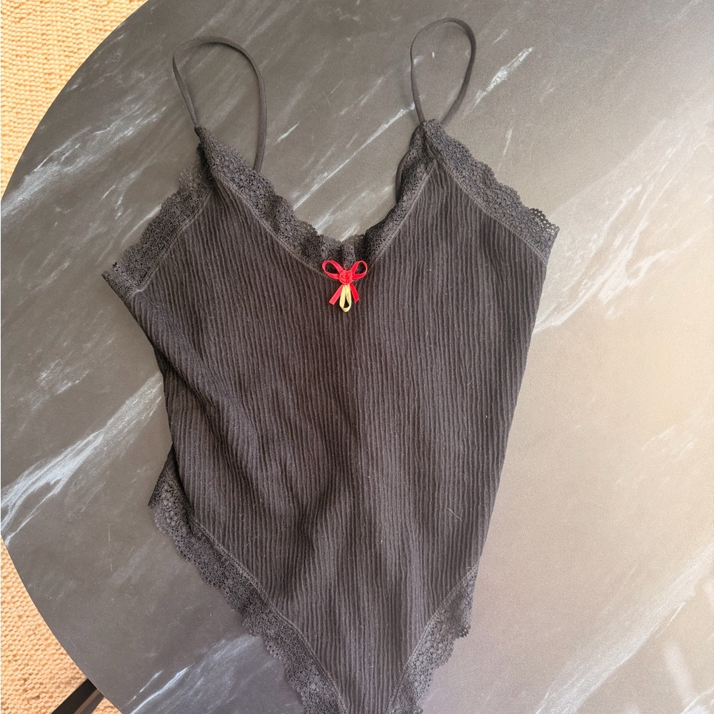 Urban Outfitters Black Lace-Trim Ribbed Bodysuit with Red Bow